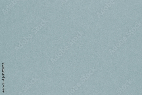 Pale blue colored paper texture. Light gray background. Graceful and refined summer wallpaper. Textured surface, fibers and irregularities are visible. Top-down