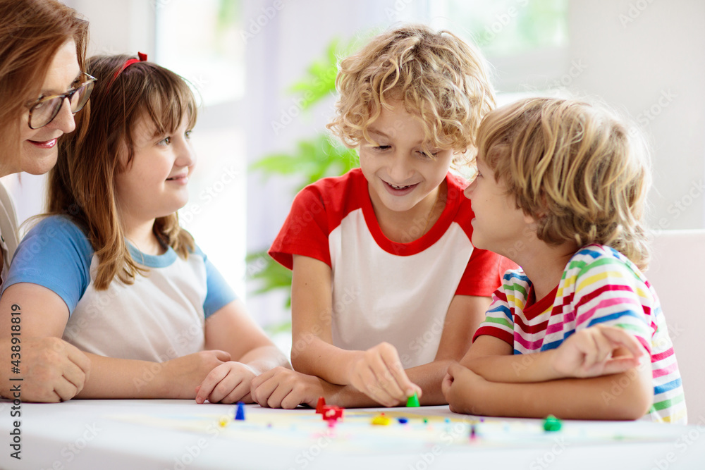 Family playing board game. Kids play. Family playing board game. Kids play.