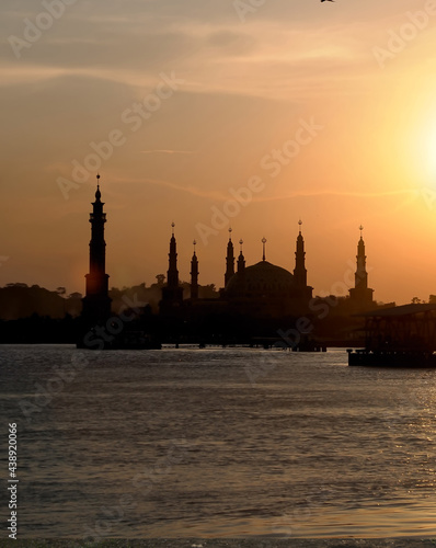 mahakam river with mosque background