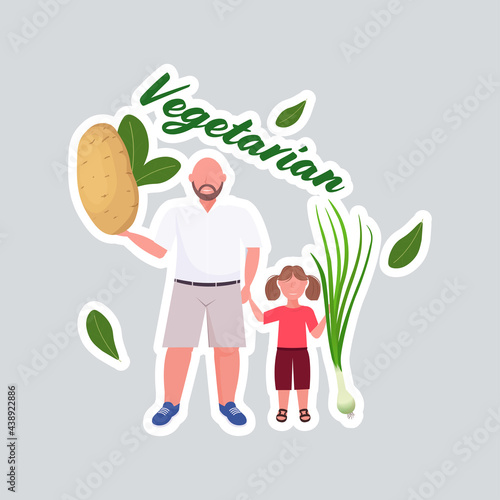 father with daughter holding potato onion vegetables healthy lifestyle vegan fresh raw food vegetarian concept full length