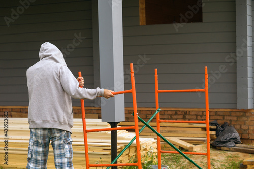 disassembling construction ladder photo