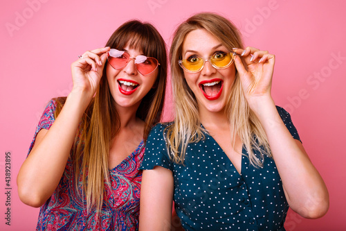 Positive portrait of best friends hipster sister girls hugs smiling