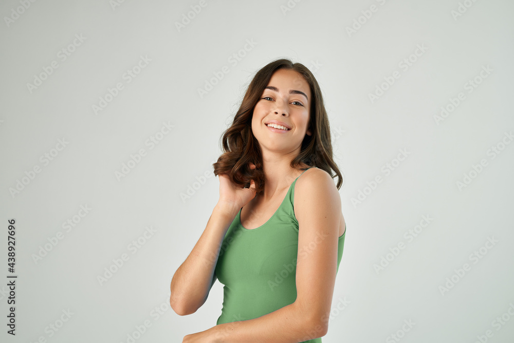 cheerful brunette woman in green t-shirt posing fashionable hairstyle cheerful brunette woman in green t-shirt posing fashionable hairstyle