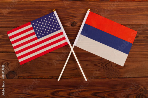 USA flag and Russia flag crossed with each other. USA vs Russia. Meeting between the presidents of the United States and Russia. Tensions in relations between the countries are growing