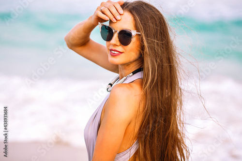Wonderful dark-haired girl in sunglasses posing at sea resort in summer vacation ©  AnnaHar