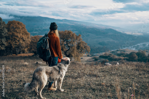 woman hiker nature mountains travel next to the dog freedom friendship © SHOTPRIME STUDIO