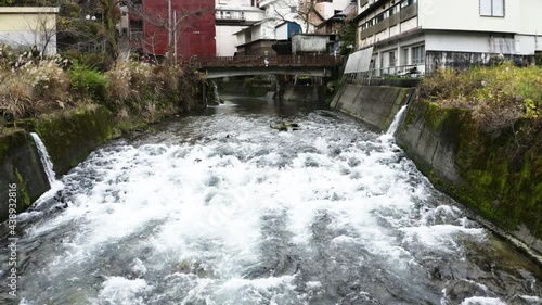 Drone shot of water flowing in the countryside of  japan
