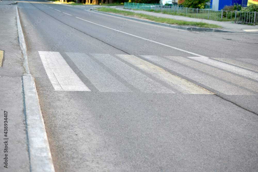 Asphalt road with markings and pedestrian crossing Asphalt road with markings and pedestrian crossing