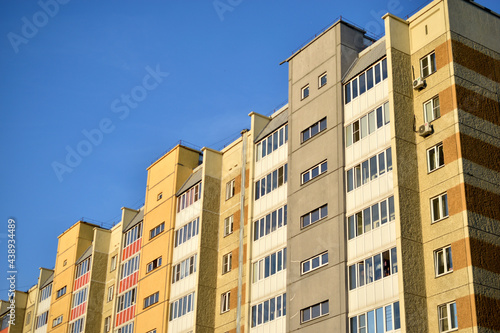 The surface and walls of a yellow high residential building