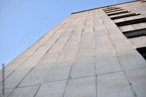 The surface and walls of a yellow high residential building