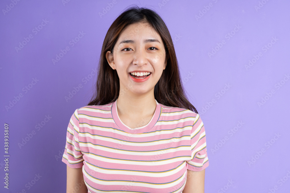 beautiful asian woman portrait, isolated on purple background beautiful asian woman portrait, isolated on purple background