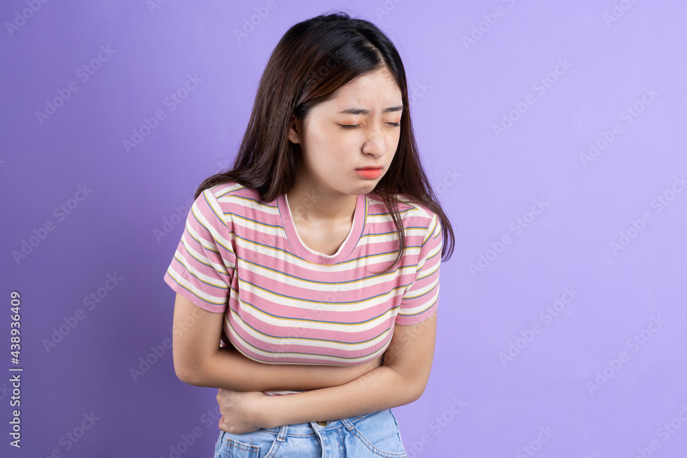 beautiful asian woman portrait, isolated on purple background beautiful asian woman portrait, isolated on purple background