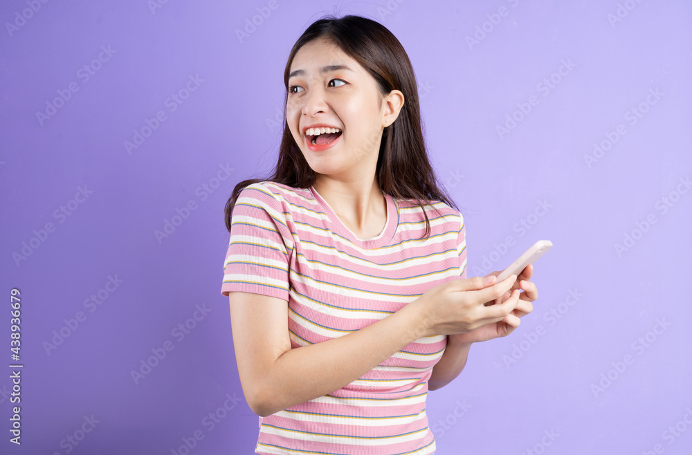 beautiful asian woman portrait, isolated on purple background beautiful asian woman portrait, isolated on purple background