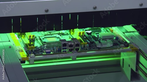 A Mid shot of motherboard on assembly line