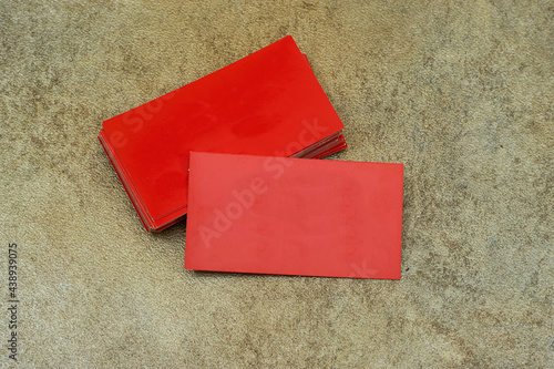 red Visit cards isolated on green background