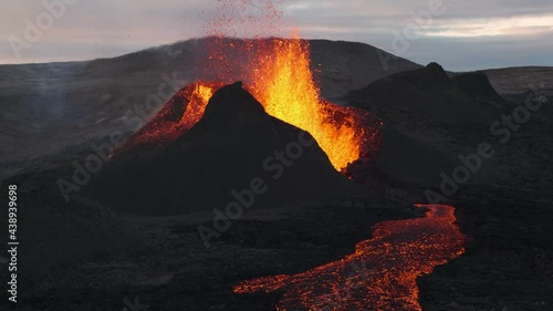 Magma flowing out of volcano crater during eruption, Fagradalsfjall in Iceland. Static view photo