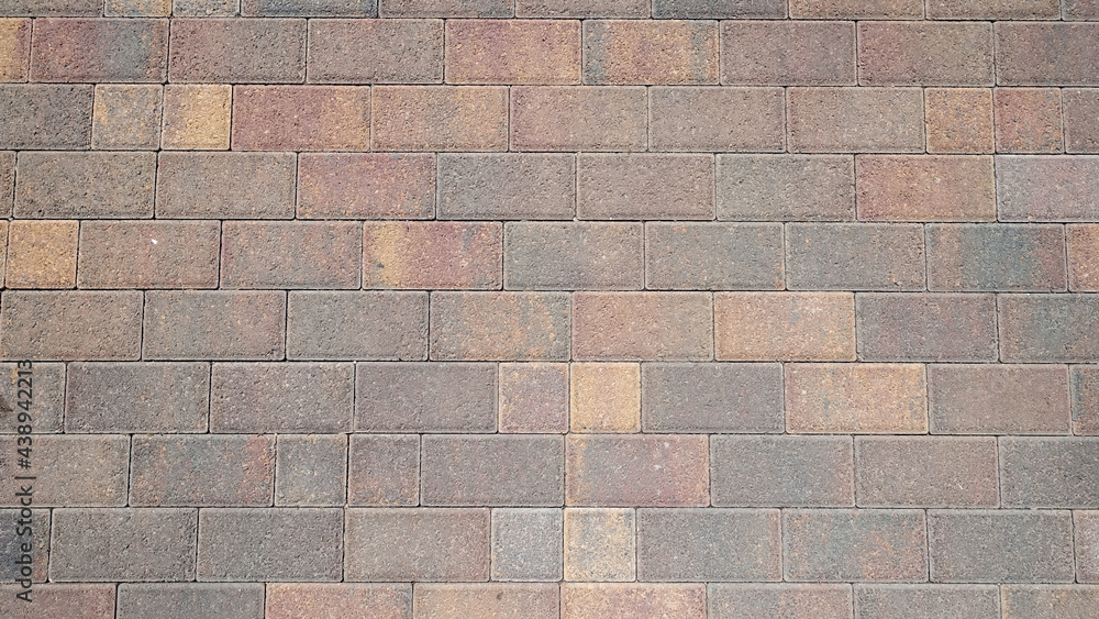 Stone beige paving stones of rectangular shape. Stone brick background. Top view Stone beige paving stones of rectangular shape. Stone brick background. Top view