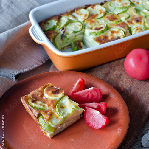 Casserole with zucchini and cheese and tomatoes.
