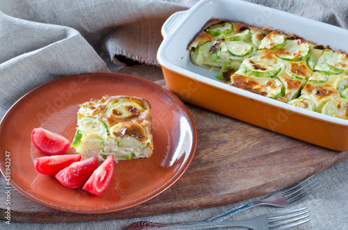 Casserole with zucchini and cheese and tomatoes.