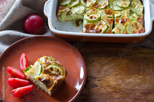 Casserole with zucchini and cheese and tomatoes.