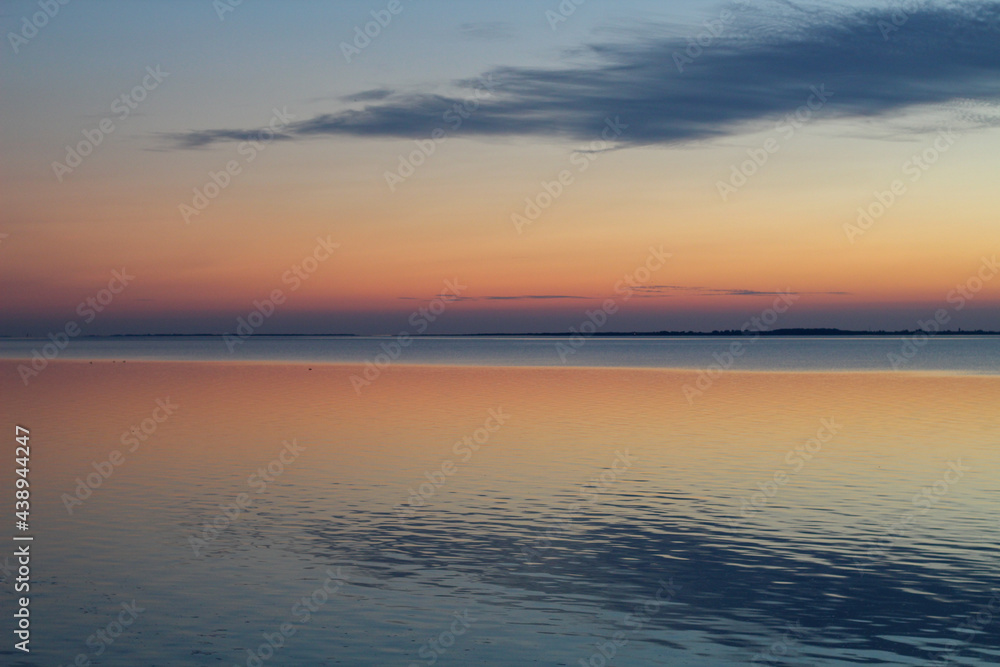 Wadden Sea: the sunset over the island of Langeoog - a play of colors Wadden Sea: the sunset over the island of Langeoog - a play of colors