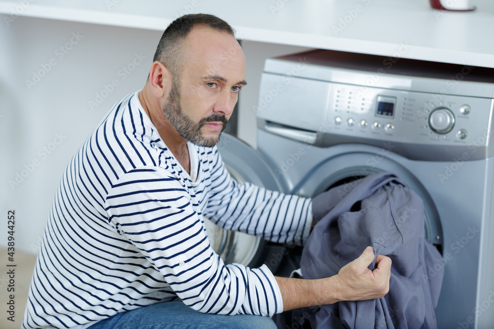 man portrait thinking about washing machine
