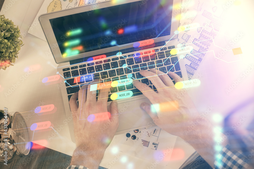 Multi exposure of man's hands typing over computer keyboard and data theme hologram drawing. Top view. Technology concept. Multi exposure of man's hands typing over computer keyboard and data theme hologram drawing. Top view. Technology concept.
