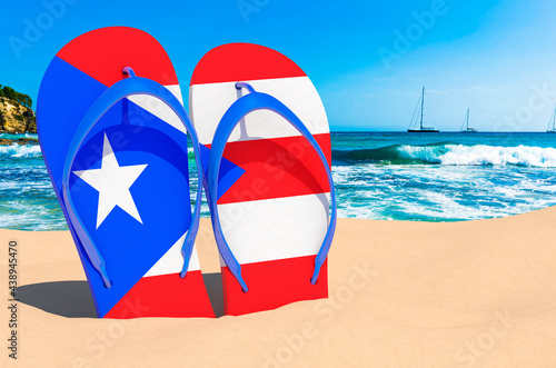 Flip flops with Puerto Rican flag on the beach. Puerto Rico resorts, vacation, tours, travel packages concept. 3D rendering