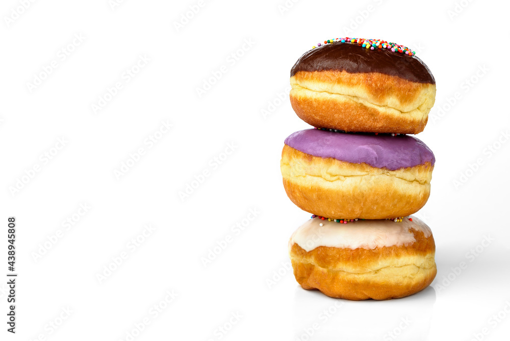 Three colorful donuts with glaze isolated on white background. Three colorful donuts with glaze isolated on white background.