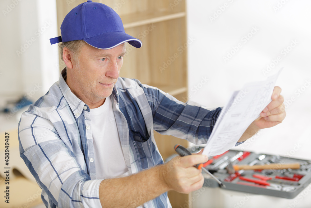 close-up of senior man holding a paper close-up of senior man holding a paper