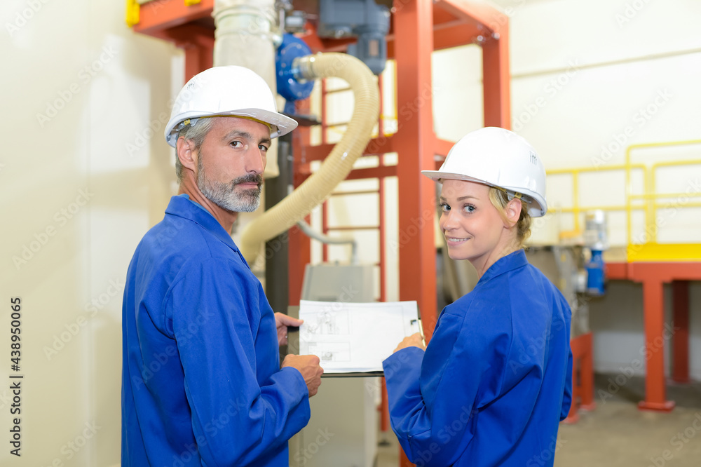an industrial worker and his colleague an industrial worker and his colleague
