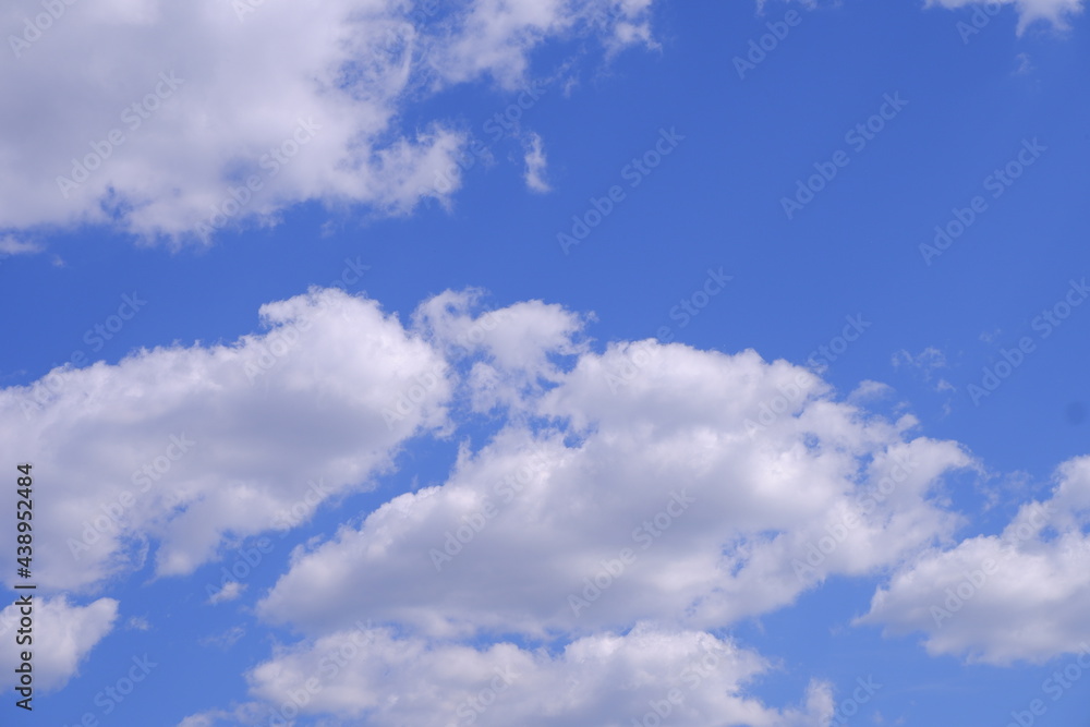 Clouds in the blue sky. Sky background. Sky texture.