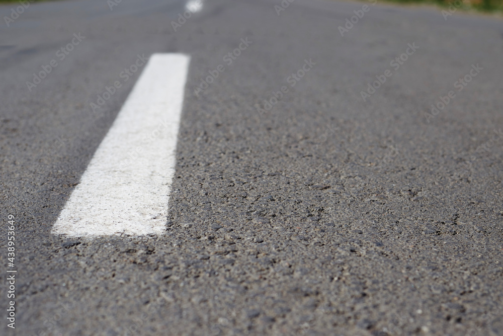 marking on the road going into the distance, asphalt road marking on the road going into the distance, asphalt road