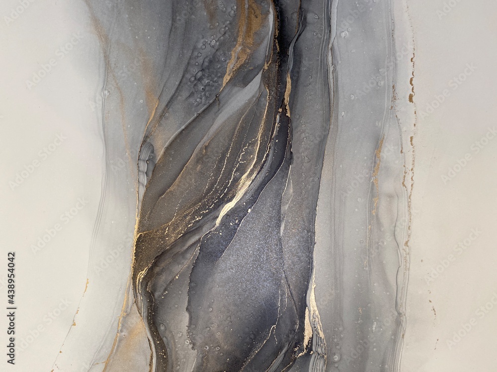 Fototapeta Abstract grey art with gold — black and white background with beautiful smudges and stains made with alcohol ink and golden paint. Grey fluid texture resembles marble, smoke, watercolor or aquarelle.