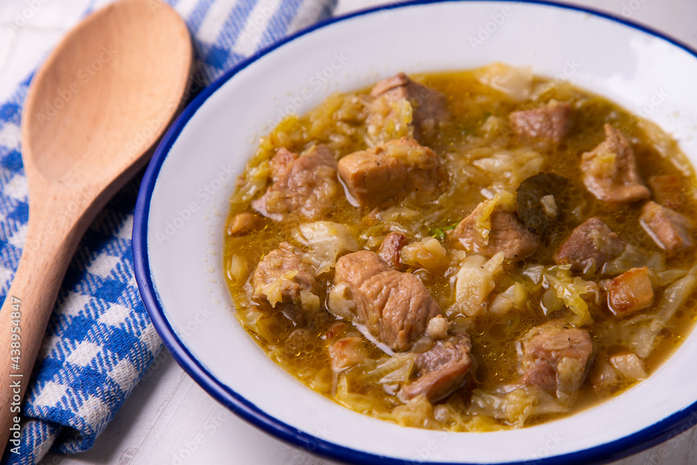Pork stew with cabbage. Traditional tapa from the central area of Spain Pork stew with cabbage. Traditional tapa from the central area of Spain