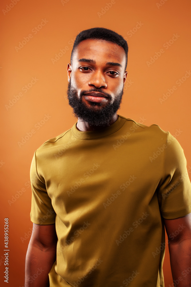 Fototapeta premium young pretty african american man posing cheerful on brown background, lifestyle people concept