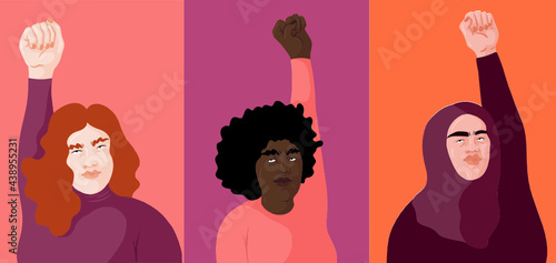 Three Feminist putting up their fists as sign of activism