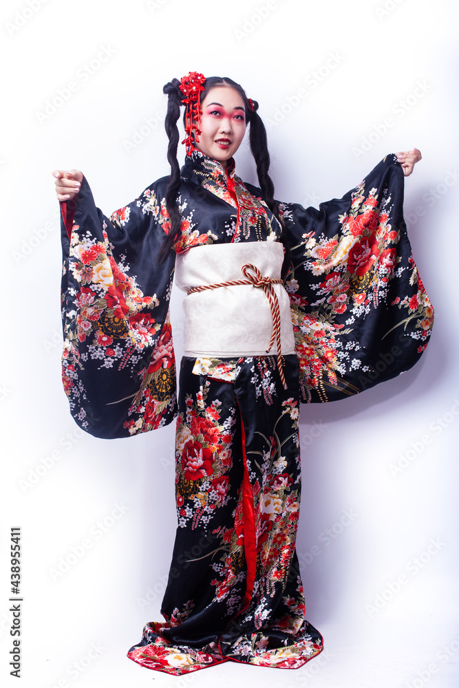 young pretty geisha in black kimono with sakura, asian ethno closeup on white background isolated young pretty geisha in black kimono with sakura, asian ethno closeup on white background isolated