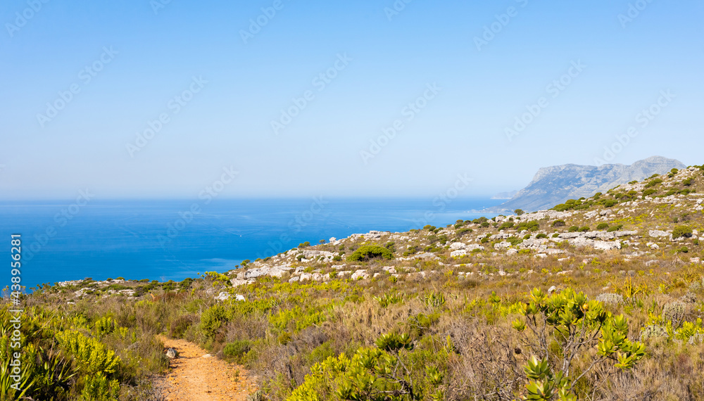 Dirt Track hiking paths on top of a mountain by the coast Dirt Track hiking paths on top of a mountain by the coast