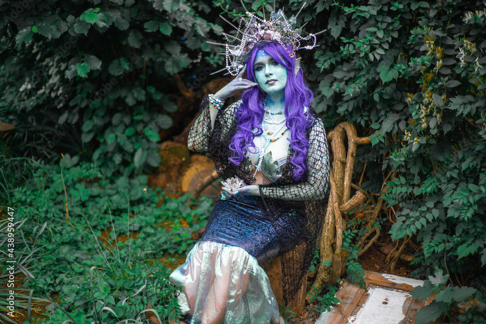 fabulous mermaid with blue skin in foliage close up fabulous mermaid with blue skin in foliage close up