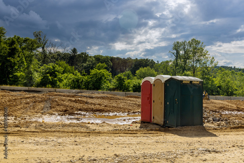 Portable restroom on the new road construction