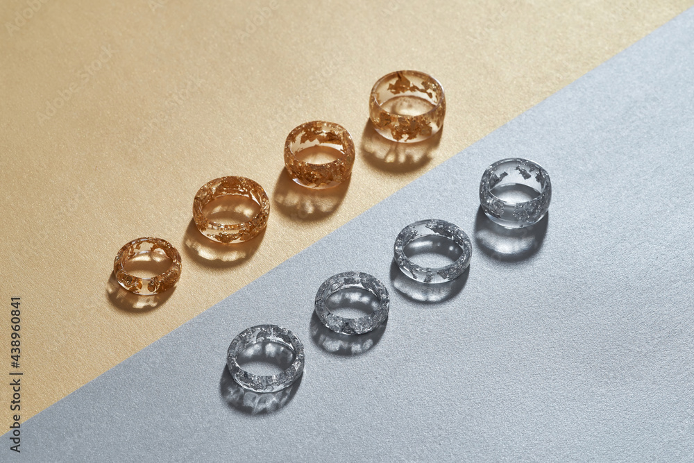Transparent resin rings with golden and silver filling Transparent resin rings with golden and silver filling