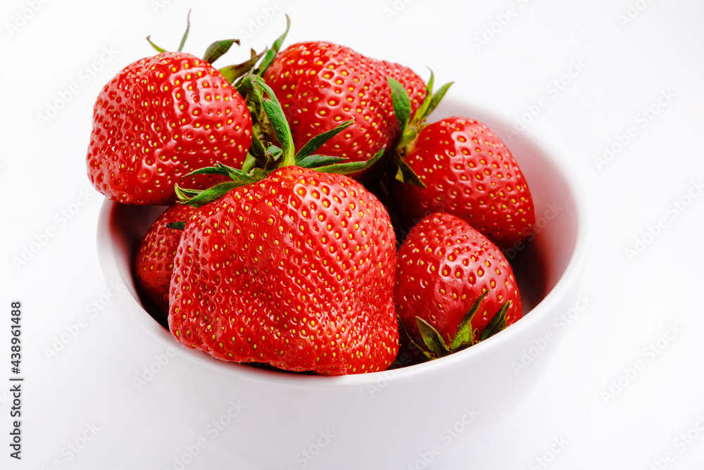 Strawberries on a white plate with white background Strawberries on a white plate with white background