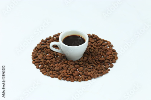 Coffee cup and beans on a white background.