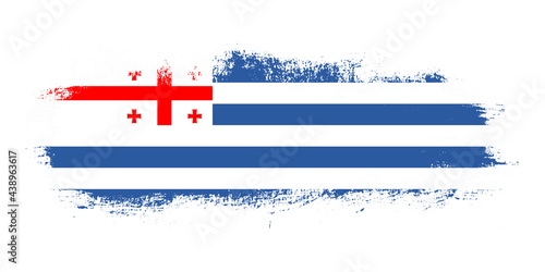 Stain brush stroke flag of Adjara country with abstract banner concept background