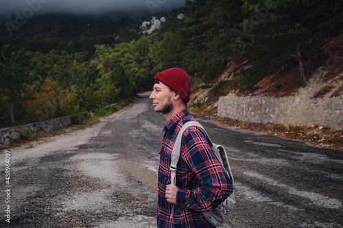 Man traveling with a backpack hiking in the mountains travel. © YURII Seleznov