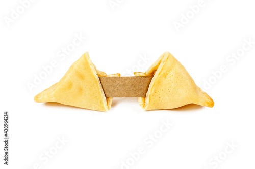 Fresh baked cracked yellow Chinese fortune cookies with copy space note isolated on white background.