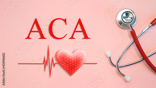 ACA - Affordable Care Act - concept with stethoscope and heart shape photo