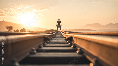Silhouette of a person on a bridge at sunset 2