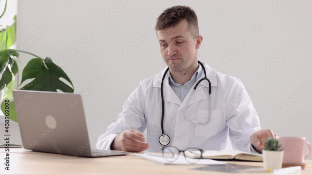 telemedicine, a European doctor in a white coat and glasses makes a note in a diary and a notebook entry, a Caucasian doctor in a hospital or clinic room makes a note in a notebook and prints on a telemedicine, a European doctor in a white coat and glasses makes a note in a diary and a notebook entry, a Caucasian doctor in a hospital or clinic room makes a note in a notebook and prints on a